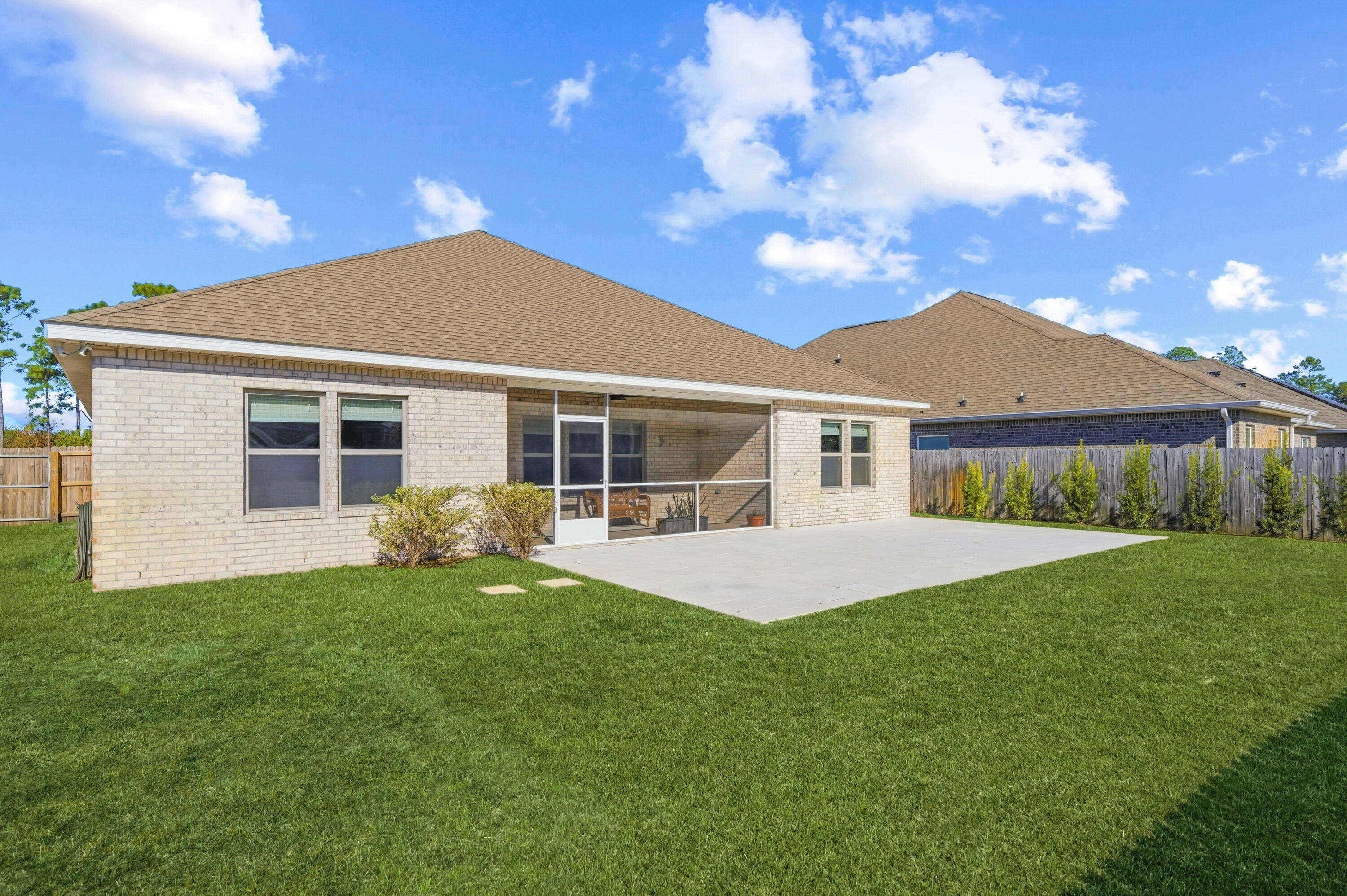 132 Wayne Trail Santa Rosa Beach, FL 32459 - Photo 4 of 43 a front view of a house with a garden
