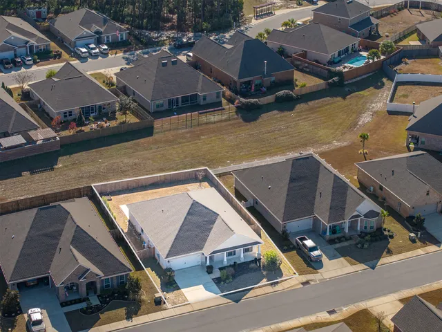 an aerial view of a house with swimming pool
