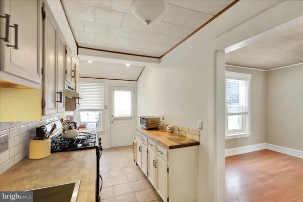a kitchen with a stove and cabinets