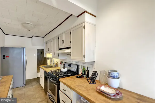 a bathroom with a sink vanity granite and a mirror