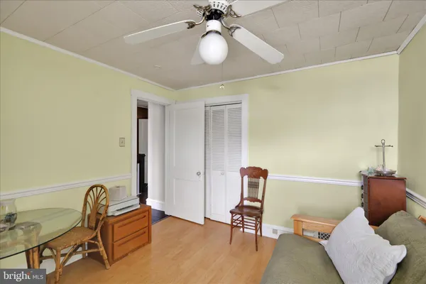 a bedroom with furniture and a window