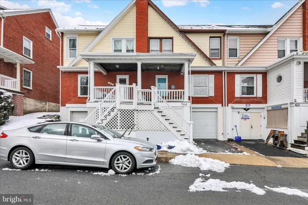 a car parked in front of a house