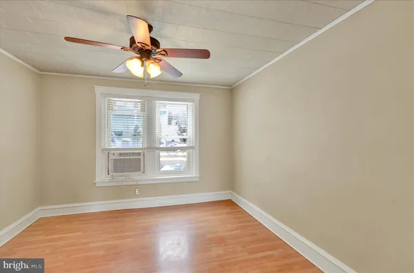 a view of a livingroom with wooden floor