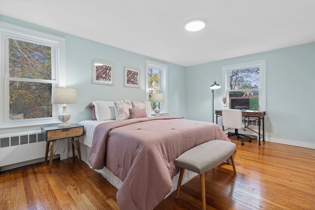 6 Puritan Lane Dedham, MA 02026 - Photo 14 of 41 a bed room with a bed and a table in it