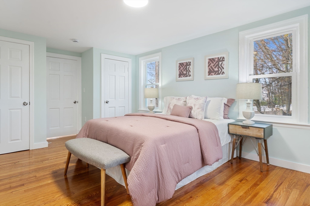 6 Puritan Lane Dedham, MA 02026 - Photo 15 of 41 a bedroom with a bed and a table