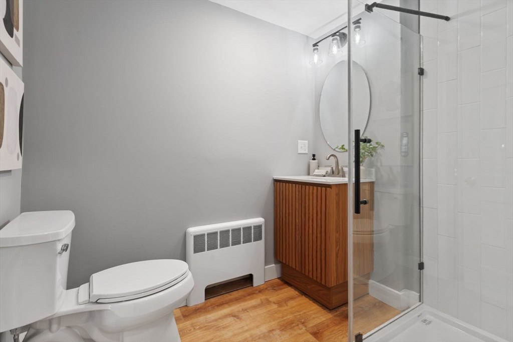 6 Puritan Lane Dedham, MA 02026 - Photo 16 of 41 a bathroom with a sink toilet and shower