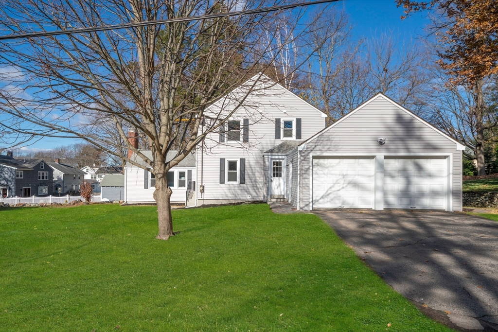 6 Puritan Lane Dedham, MA 02026 - Photo 2 of 41 a view of a white house with a yard