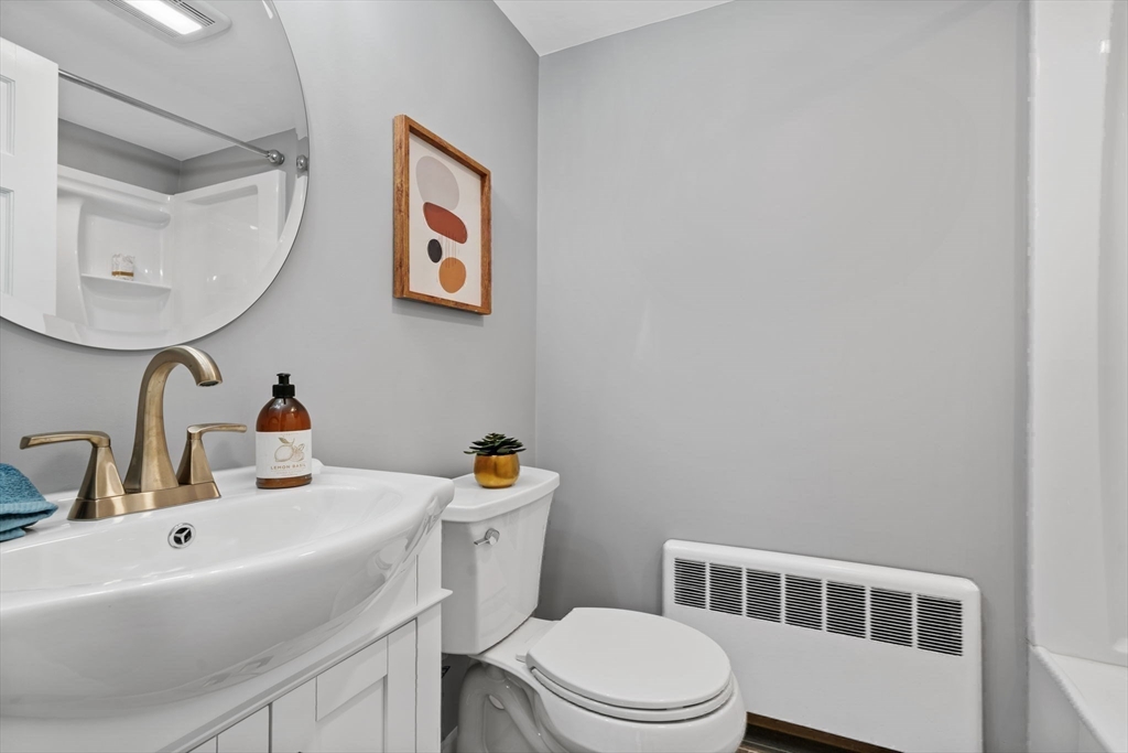 6 Puritan Lane Dedham, MA 02026 - Photo 27 of 41 a bathroom with a sink mirror and toilet
