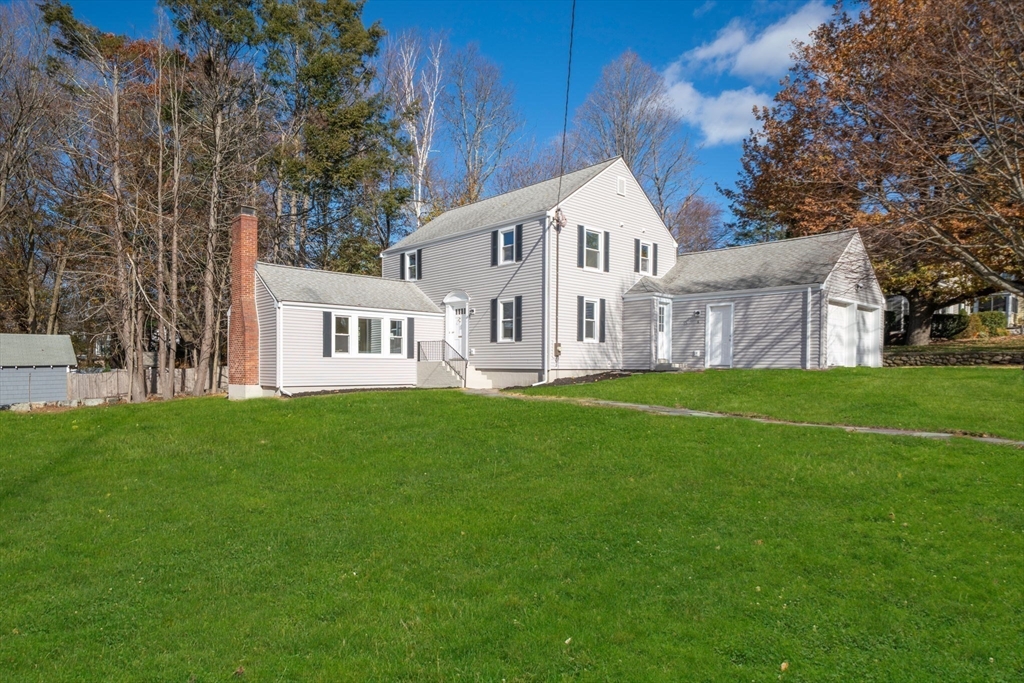 6 Puritan Lane Dedham, MA 02026 - Photo 33 of 41 a front view of house with yard and green space
