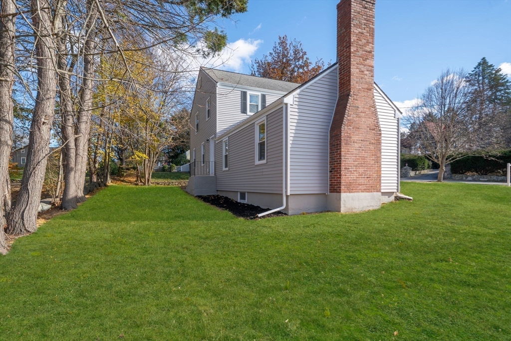 6 Puritan Lane Dedham, MA 02026 - Photo 34 of 41 a view of a house with backyard