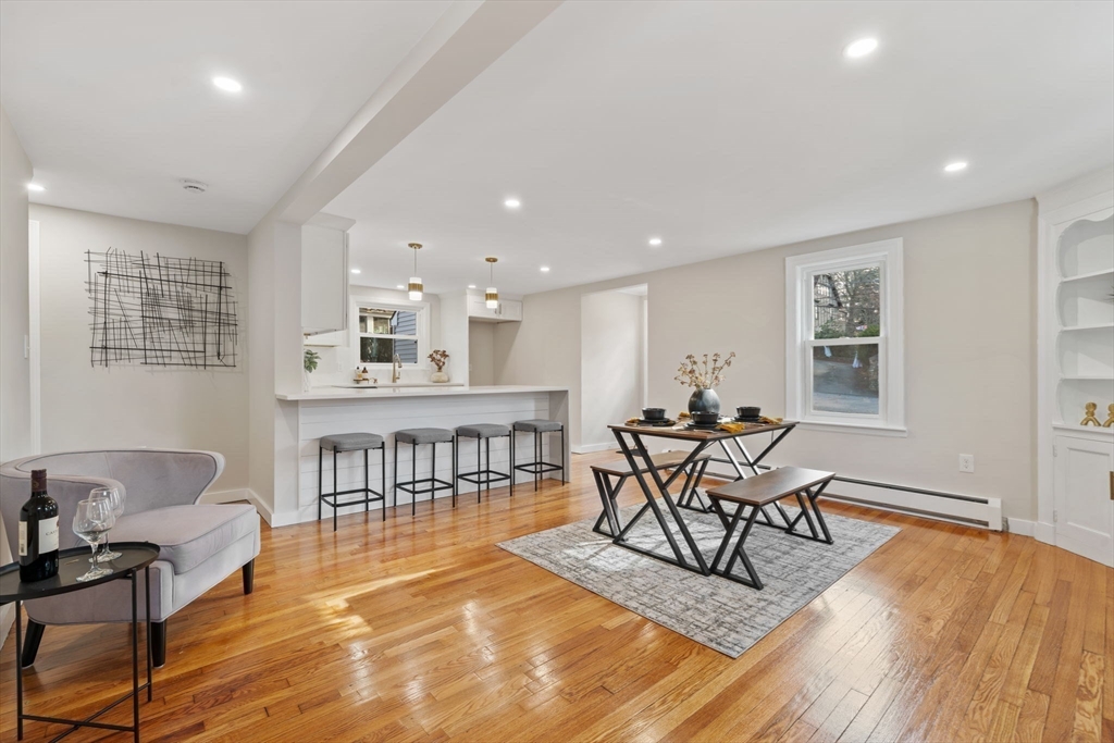 6 Puritan Lane Dedham, MA 02026 - Photo 8 of 41 a view of a dining room with furniture window and wooden floor