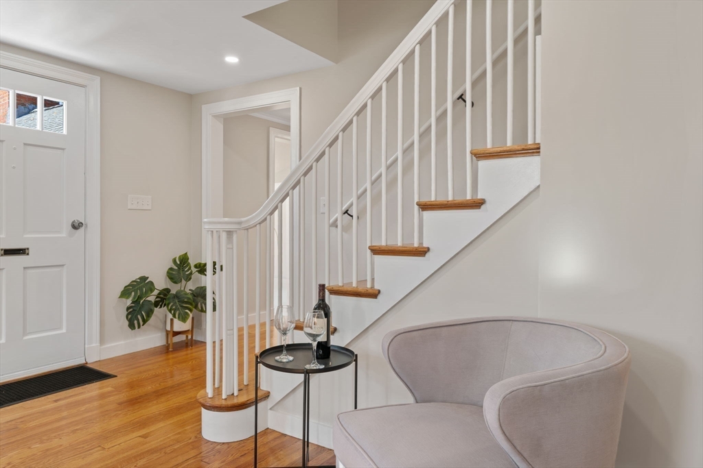 6 Puritan Lane Dedham, MA 02026 - Photo 9 of 41 a living room with furniture and a potted plant