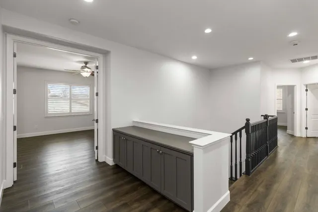 a bedroom with a large bed and a couch