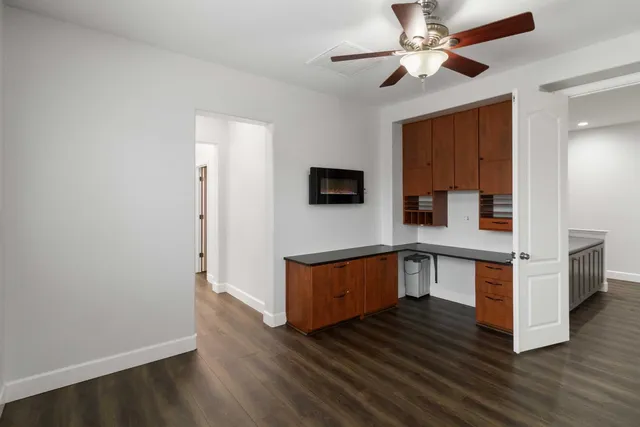 a spacious bathroom with a double vanity sink mirror and bathtub