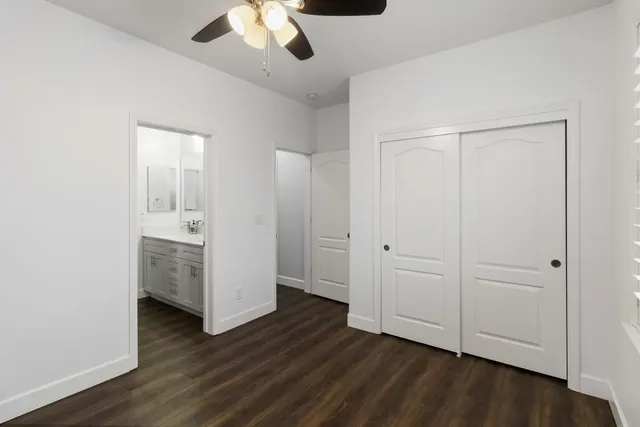 a bathroom with double vanity sinks and a mirror