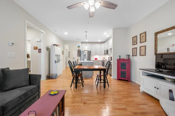 a view of kitchen with dining table and chairs