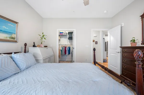 a bedroom with a bed and a dresser