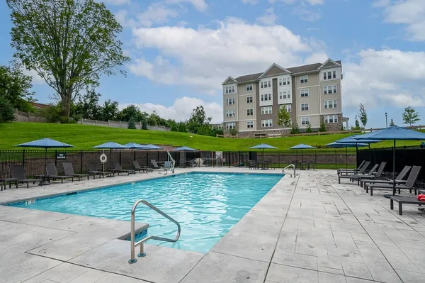 a view of a swimming pool with a patio