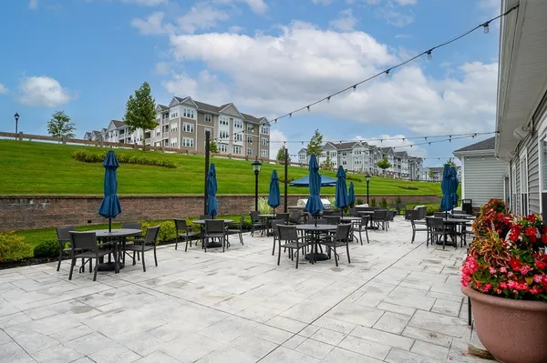 a view of a patio with chairs and tables