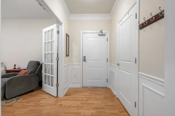 a view of a hallway with closet and a couch