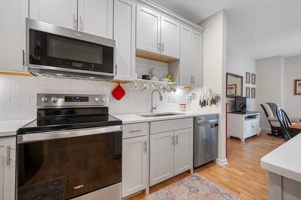 a kitchen with a stove and a microwave