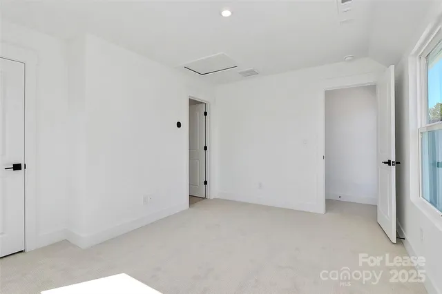 a balcony with trees in front of it