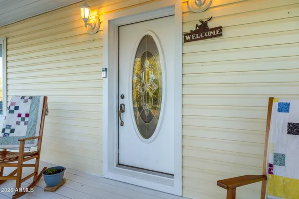 a view of a balcony with chairs