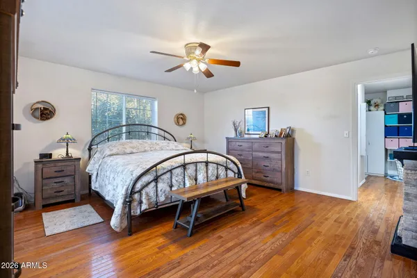 a spacious bedroom with a bed and a fireplace