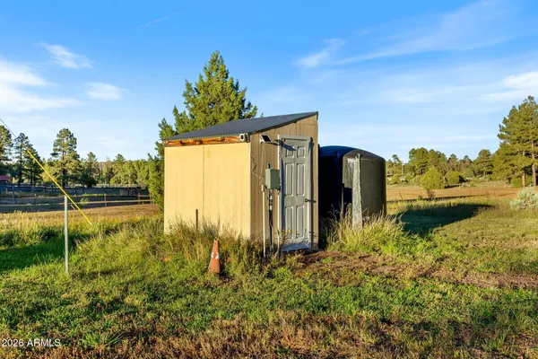 an aerial view of a house with garden space and sitting area