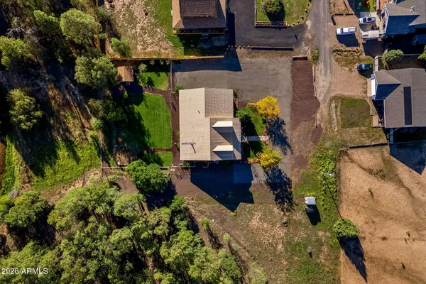 an aerial view of residential house with outdoor space