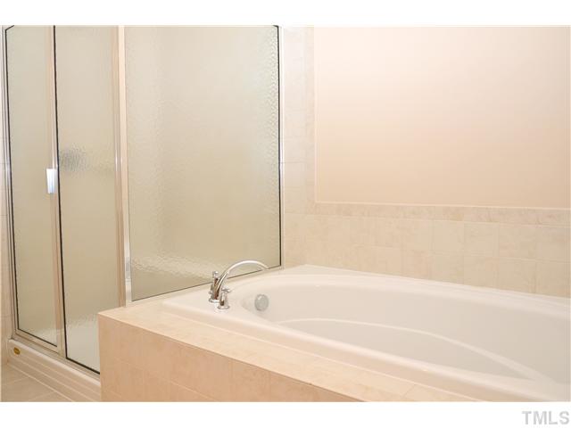 3517 Stonebend Loop Cary, NC 27518 - Photo 13 of 21 a white bath tub sitting next to a white sink