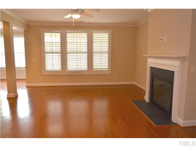 3517 Stonebend Loop Cary, NC 27518 - Photo 5 of 21 a view of an empty room with wooden floor and a window