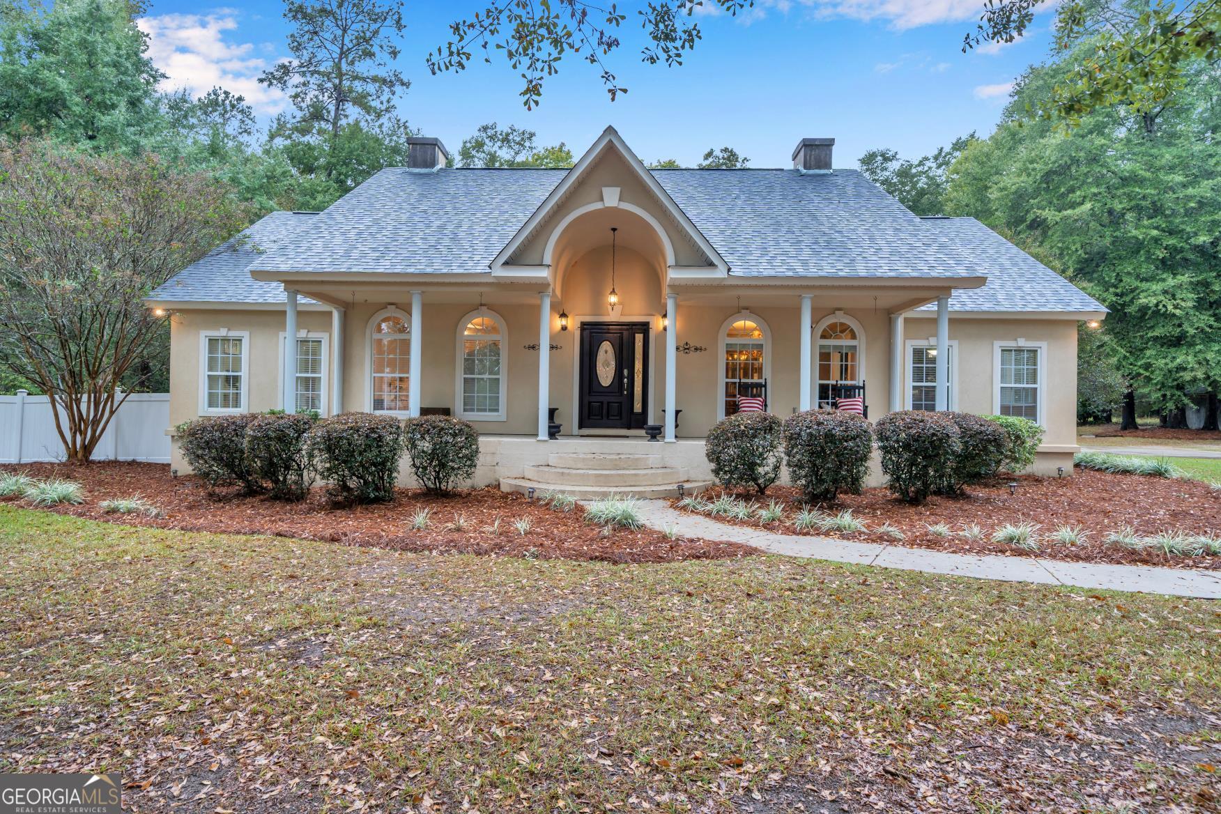 620 Hatchee Ridge Road Dublin, GA 31021 - Photo 1 of 1 a front view of a house with a yard and garage