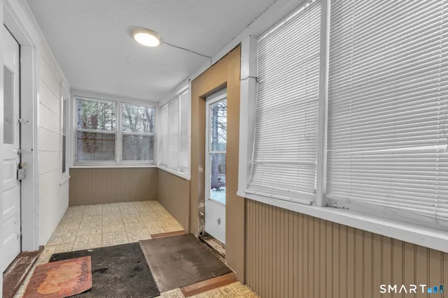 a view of an empty room and window