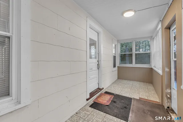 a view of an empty room and window