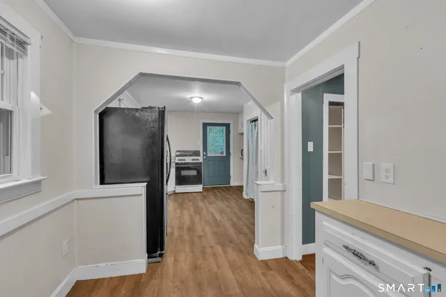 a view of a kitchen cabinets and wooden floor