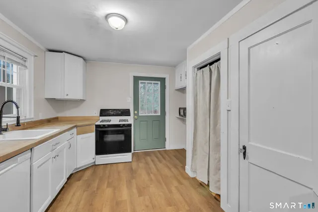 a kitchen with stainless steel appliances granite countertop a stove and a refrigerator