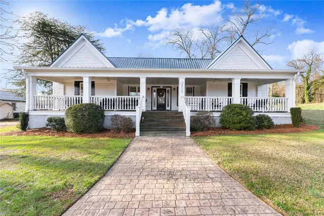 a front view of a house with garden