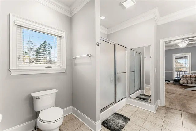 a bathroom with a toilet sink and shower