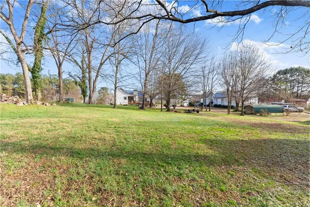 a view of a field with tree s