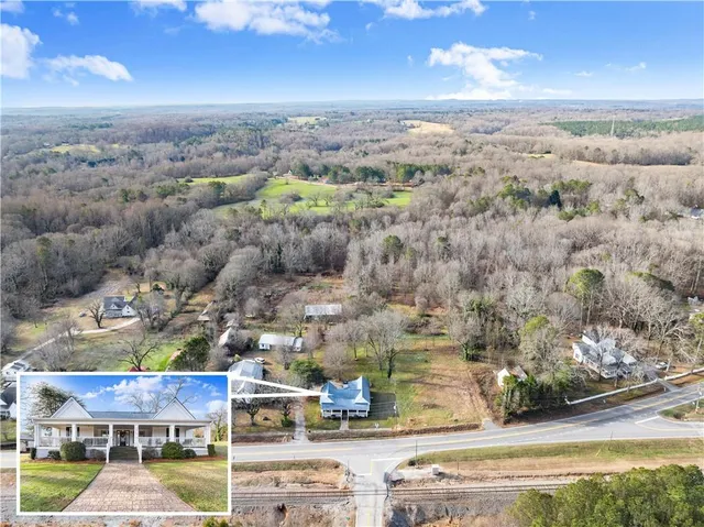 an aerial view of residential houses with outdoor space