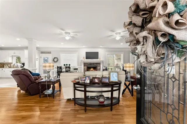 a living room with furniture and wooden floor