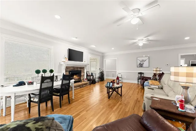 a living room with furniture fireplace and a flat screen tv