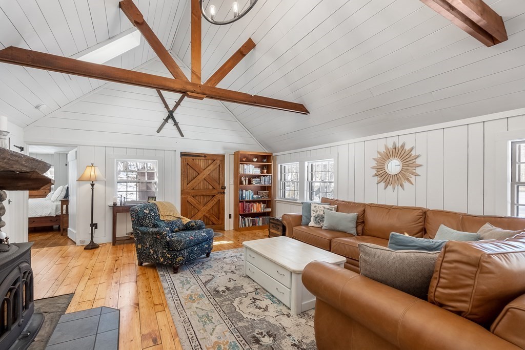 472 Sugar Road Bolton, MA 01740 - Photo 14 of 30 a living room with furniture and a flat screen tv