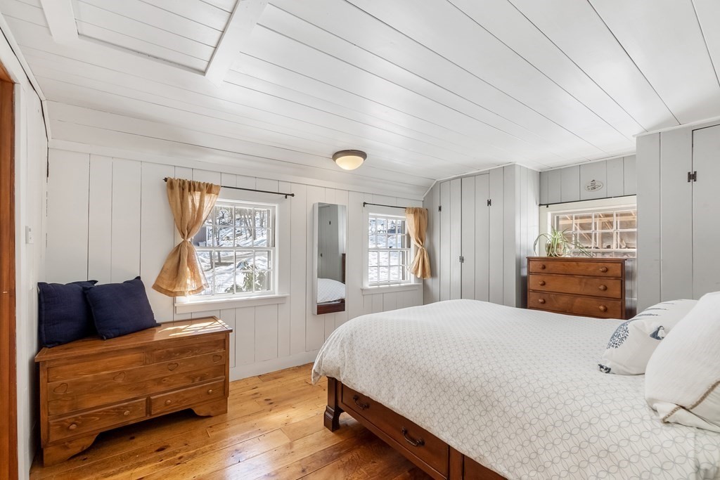 472 Sugar Road Bolton, MA 01740 - Photo 15 of 30 a spacious bedroom with a bed and wooden floor