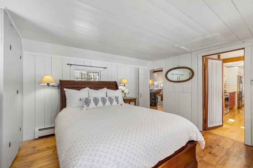 472 Sugar Road Bolton, MA 01740 - Photo 16 of 30 a bedroom with a bed and a lamp on dresser