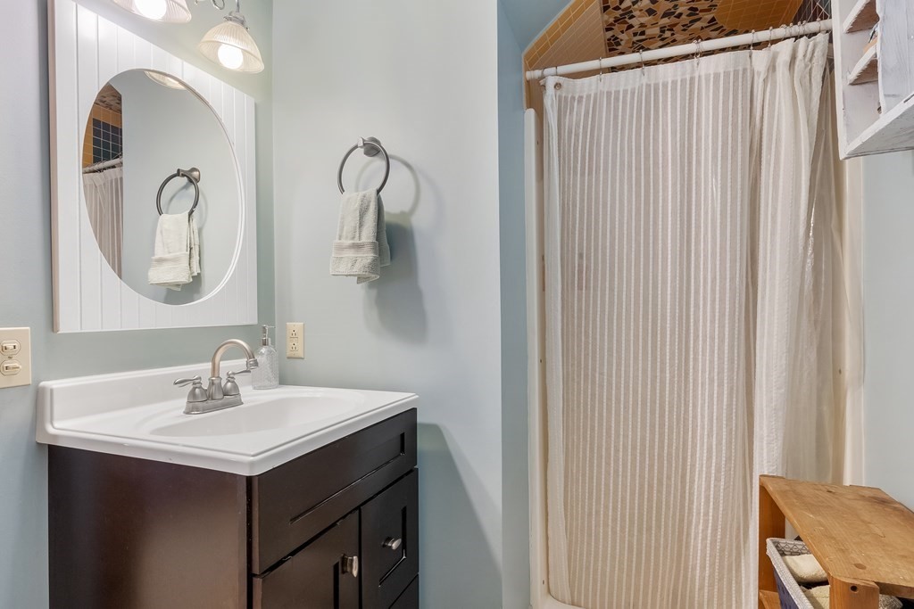 472 Sugar Road Bolton, MA 01740 - Photo 18 of 30 a bathroom with a sink and a mirror