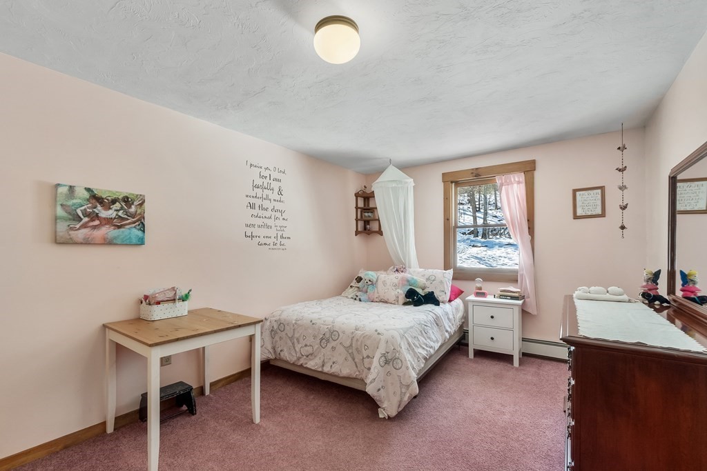 472 Sugar Road Bolton, MA 01740 - Photo 20 of 30 a bedroom with a bed and a table