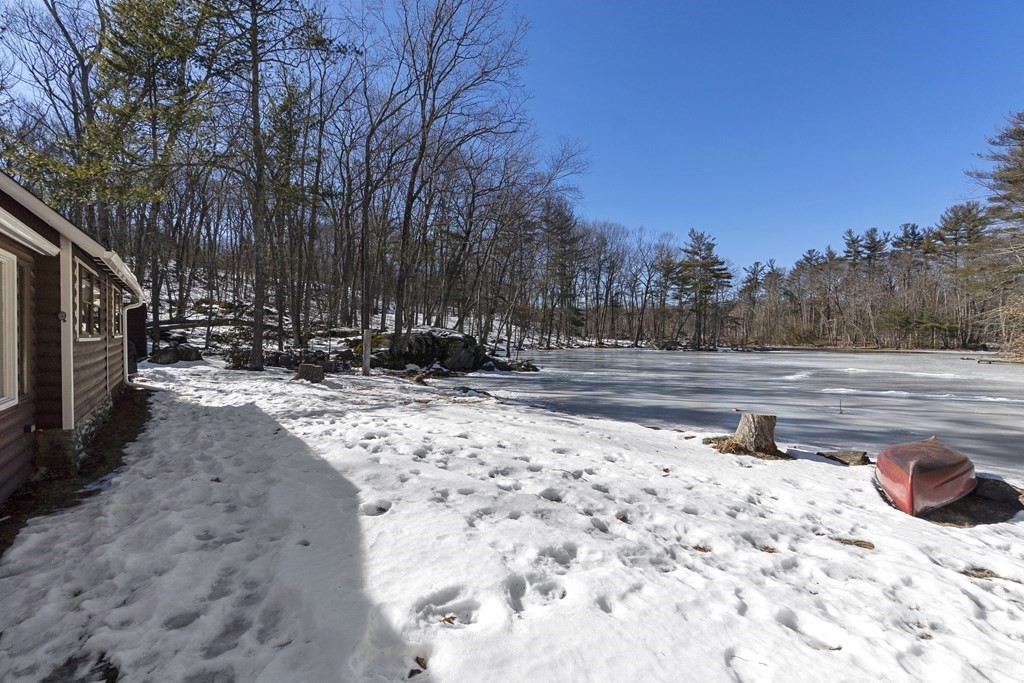 472 Sugar Road Bolton, MA 01740 - Photo 25 of 30 a view of a yard with snow on the road