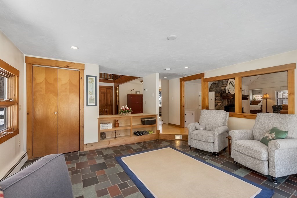 472 Sugar Road Bolton, MA 01740 - Photo 7 of 30 a living room with furniture and large windows